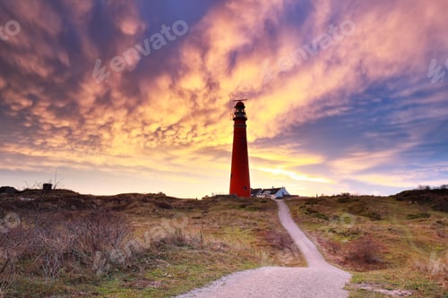 Preview: dramatic mammatus clouds over red lighthouse