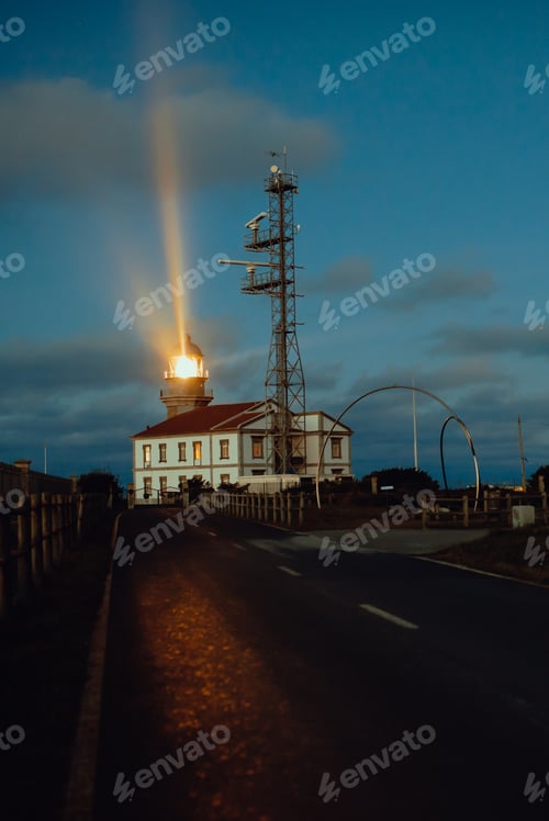 Preview: Road and lighthouse in evening