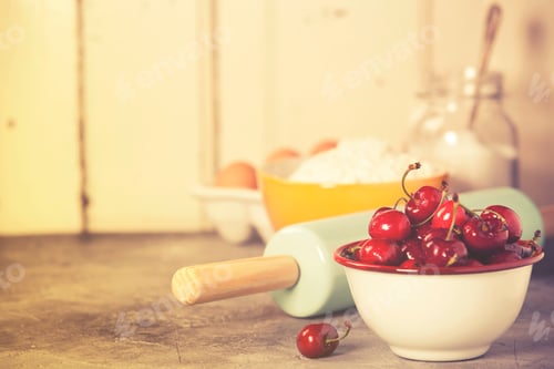 Preview: Mixed berries, baking ingredients and utensils