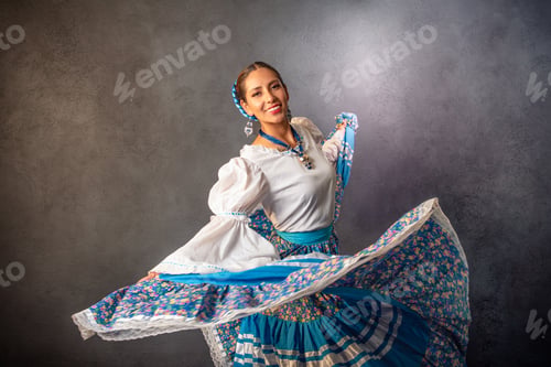 Preview: A woman in a blue skirt is dancing and smiling