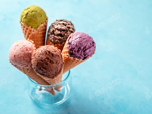 Preview: ice cream scoops in cones with copy space on blue