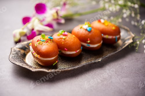 Preview: Malai Chop or Cream sandwich made using filling Rasgulla or Gulab jamun sweet is a Bengali sweet
