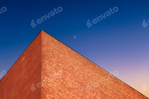 Preview: A building against a celestial gradient during sunset. Sky color gradient as a background.