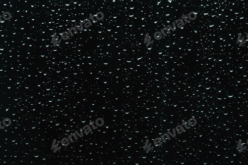 Preview: Raindrops on black window glass as background