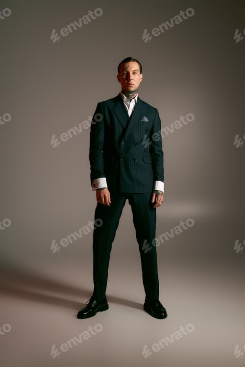 Preview: Stylish young man showcasing modern fashion in a sleek and sophisticated setting