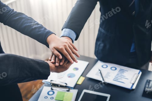 Preview: Business people at meeting showed the power and unity of working together teamwork.
