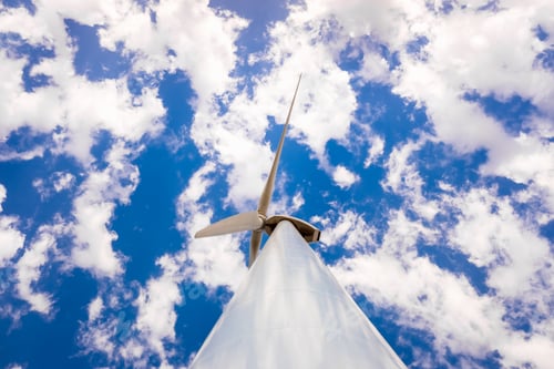 Preview: Wind turbines on top of a Spanish mountain with sky full of clouds on a summer day.