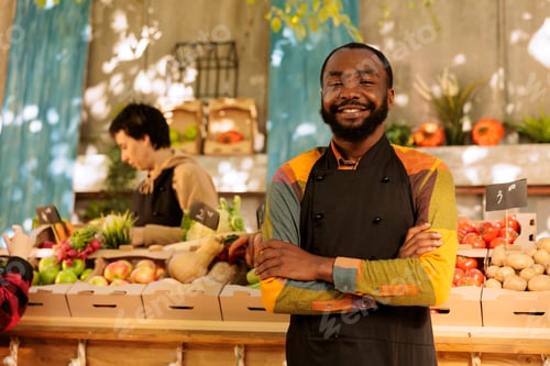 Preview: Man at food marketplace looking at camera