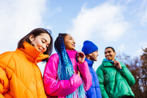 Preview: Multiracial group of young friends meeting outdoors in winter