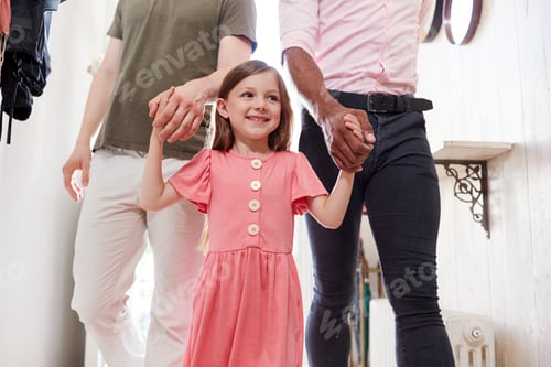 Preview: View Inside Hallway As Same Sex Male Couple With Daughter Open Front Door Of Home