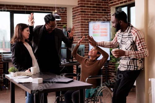 Preview: Multiethnic group of people having fun at work on break