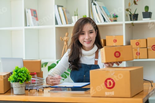 Preview: Young Asian woman entrepreneur working at home office, BOX,smartphone,laptop, online, marketing, pac