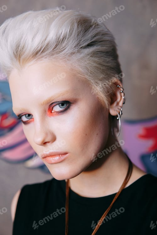 Preview: Portrait of a young fashionable blonde girl with an original hairstyle