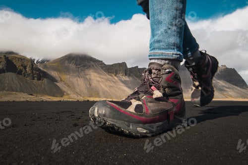 Preview: Crop tourist walking on picturesque valley