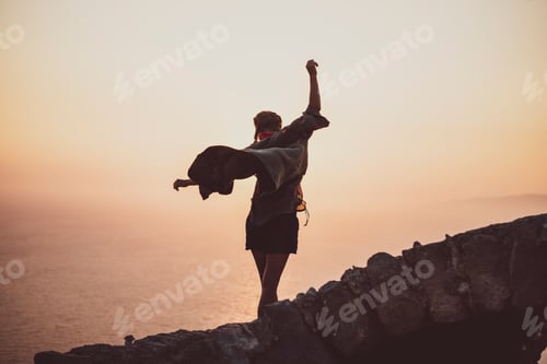 Preview: Woman balancing on stones in Monolithos castle in Rhodes, Greece