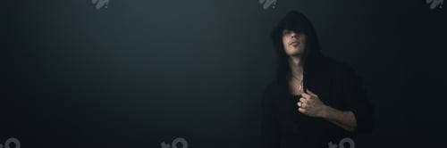 Preview: Mysterious Hooded Man Portrait Wide Banner with Copy Space