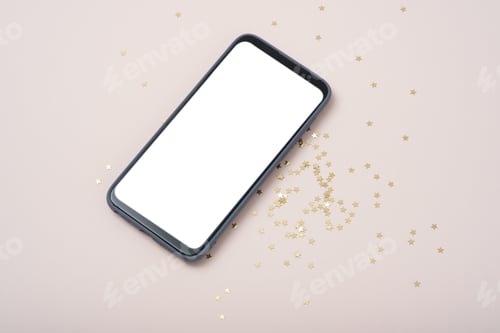 Preview: Modern smartphone with mockup on beige background with christmas decoration