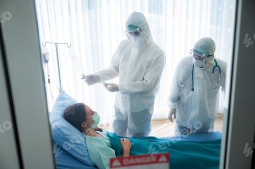 Preview: Woman in Hospital Bed with Healthcare Workers