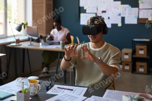 Preview: Young Adult Caucasian Man Experiencing Virtual Reality Simulation at Workplace
