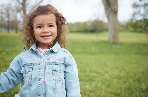 Preview: Child, face and park with grass field while outdoor for fun, travel and freedom in spring on vacati
