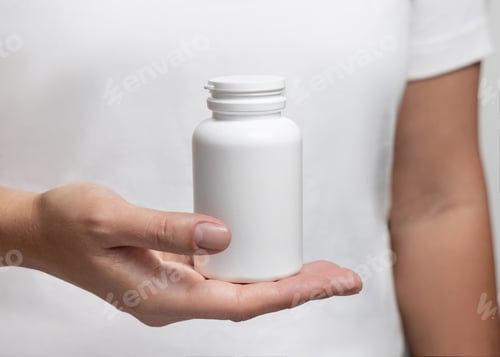 Preview: Hand Holding a White Bottle Close Up