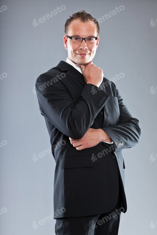 Preview: Happy Young Business Man With Short Hair Wearing Dark Suit With White Shirt And Purple Tie. Wearing