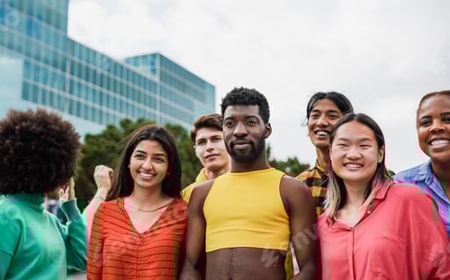 Preview: Happy young multiracial people having fun together in the city