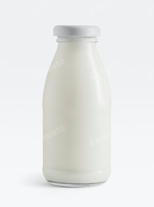 Preview: Fresh milk in a glass bottle on white background