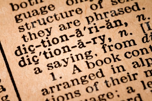 Preview: Close-up of an Opened Dictionary showing the Word DICTIONARY