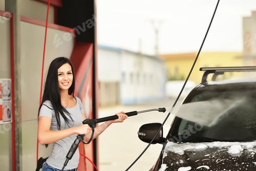 Preview: Young Woman Washing The Car Smiling.
