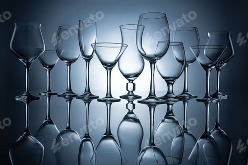 Preview: silhouettes of different empty glasses with reflections, on grey