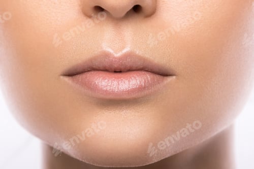 Preview: Close up of beautiful female lips on white background