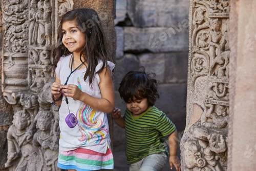 Preview: Two kids exploring ancient ruins with curiosity and joy.