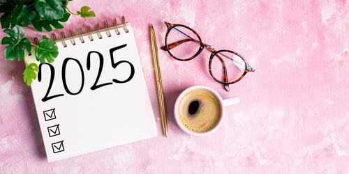 Preview: New year resolutions 2025 on desk. 2025 goals list with notebook, coffee cup, plant on pink table