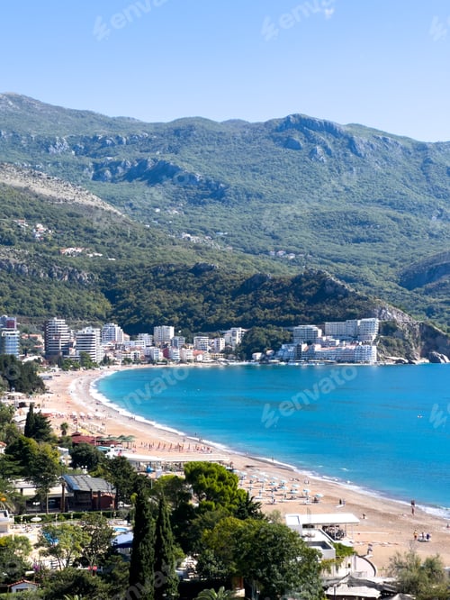 Preview: Becici beach by the sea with high-rise hotels on the shore. Budva Riviera, Montenegro