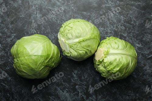 Preview: Fresh green cabbage on black smoky background