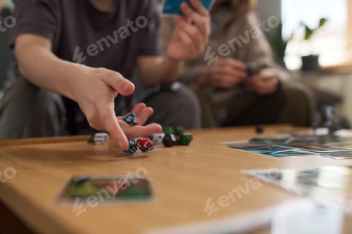 Preview: Closeup of Teenager Throwing Dice