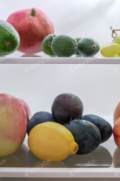 Preview: open fridge with fresh fruits and vegetables. refrigerator with healthy food.Healthy food concept
