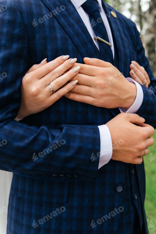 Preview: Man and woman are hugging each other in a blue suit