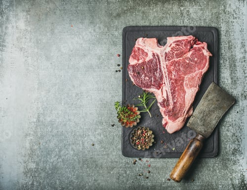 Preview: Fresh raw beef uncooked t-bone steak with spices, copy space