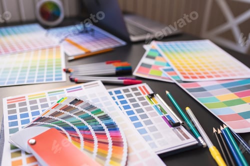 Preview: Color swatches of graphic designers putting on desk table.