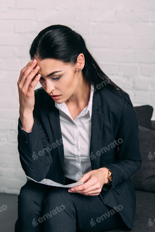 Preview: portrait of tired businesswoman with papers in office