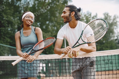 Preview: Two tennis players talking on a tennis court before the match