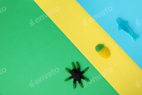 Preview: Tasty gummy candies on three tone background