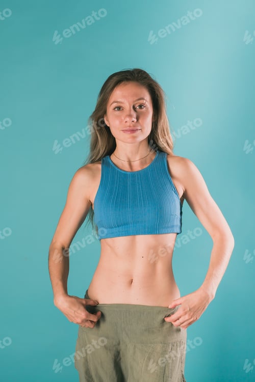 Preview: Portrait of young slim fitness woman. Sport and healthy lifestyle concept