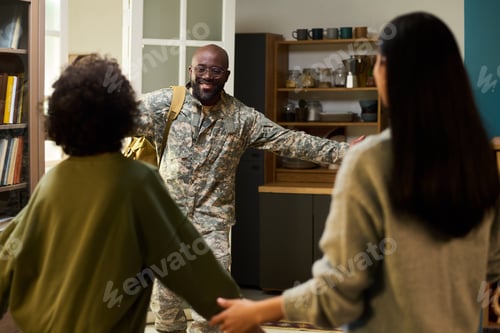Preview: Middle Aged Black Man in Military Uniform Greeting Family at Home Entrance
