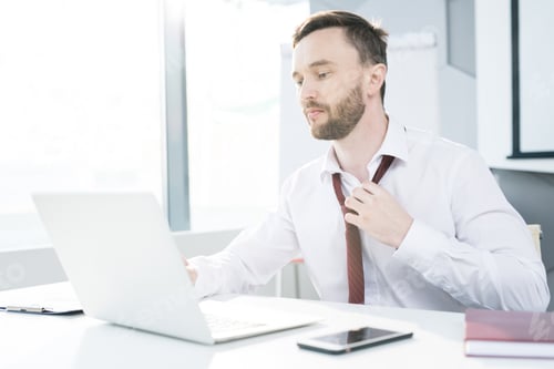Preview: Businessman Loosening Tie