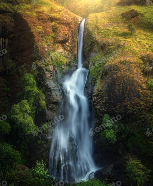 Preview: Waterfall in autumn forest at sunset in Nepal. Colorful landscap