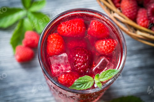 Preview: Closeup of juice made of fresh raspberries and ice