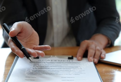 Preview: Businessmen selling the house pointing at signing of sale contract.